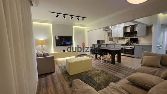 شقة مفروشة بحديقة خاصة  للإيجار في Stone Residence | 128م + حديقة 50م | 2 Bedrooms | Long-Term بـ50 ألف شهريا