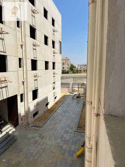Apartment for sale in Al-Narges Al-Jadida - Harf K, first number from Gamal Abdel Nasser axis next to Arbella Plaza and near the German University and Jomla Market