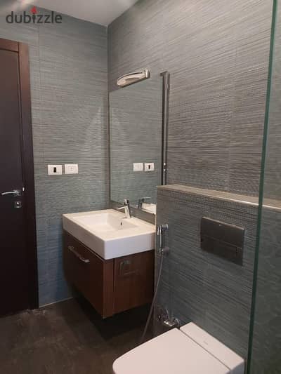 165 sqm apartment for sale in SODIC Courtyards, 2 bedrooms, 3 bathrooms, kitchen with appliances and installed ACs, prime location.