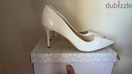 brand new never used white heels