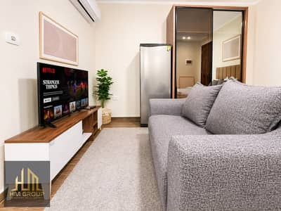 Fully furnished studio for rent inside Eastown, with a modern design and practical layout that offers comfort and privacy, plus a standout exterior.