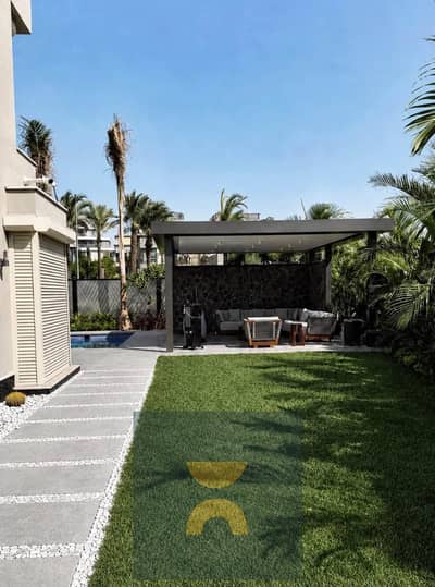Corner villa with 5 bedrooms 3 floors and direct lake view 12 year installments in Sarai near Madinaty Butterfly and Mountain View