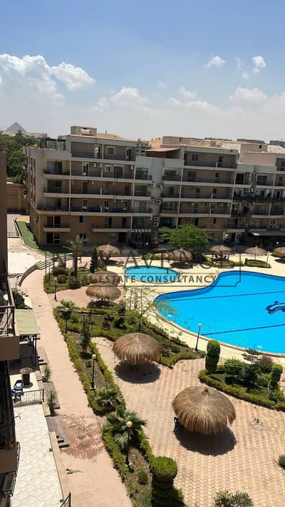 Fully finished Apartment with Pyramids View direct on Pool for sale in Pearl pyramids October Next to pyramids hills and grand egyptian museum