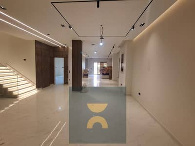 Townhouse villa in a premium villa only phase 50 percent discount near El Shorouk gates directly on Suez Road next to Madinaty minutes from Privadoy