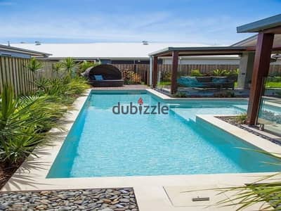 Villa with a private pool and a 125m² garden in Zayed, facing Beverly Hills. Available for sale at the lowest price; features a ground floor, first fl