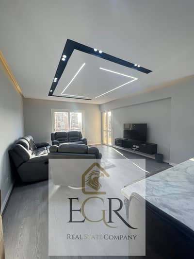For rent, a fully furnished luxury apartment in Al-Rehab 2 with a wide garden view