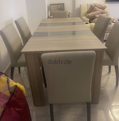 6 seater dining table with two storage compartments , great condition