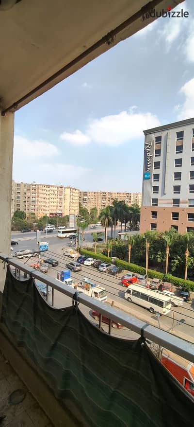 120m apartment for sale in Sheraton Airport on Nasr Street in front of Radisson Blu Hotel, fourth floor, front facing, 3 rooms and 2 bathrooms, 2 elevators, first owner and share in the land, 3.5 million negotiable