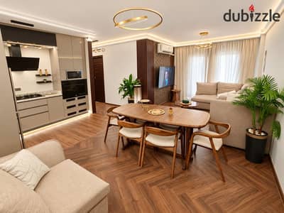 Apartment for sale cash in Madinaty B7 - Wide garden view and club and SPINE - hotel finishing - area of 96 meters - first row on The_Spine - a distinctive location close to the most important service areas
