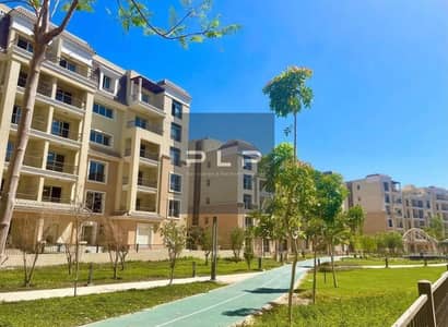 resale ground apartment with garden in Sarai Elan phase in New Cairo opposite Madinety and Al Amal Axis directly on Suez Road