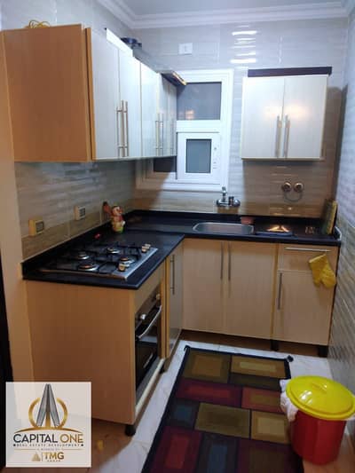 Apartment for rent (standard contract) in Madinaty, B12. Area: 72 sqm. Includes a fully equipped kitchen, air conditioning units, a living room set, a