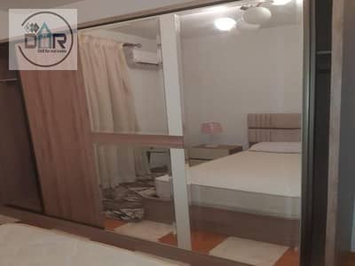 Modern furnished two-bedroom hotel apartment for rent in Rawda Zayed Compound, close to all services.