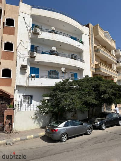 House for sale in Al-Obour City, fully finished and ready for delivery, a vibrant residential area with a large garden view.