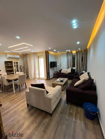 Furnished ground-floor apartment with a garden for rent in Al Rehab; prime location near Services, featuring custom finishing.