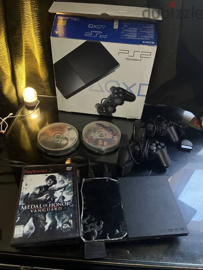 PlayStation 2  استعمال خفيف جدًا + أكثر من 25 لعبة  ا