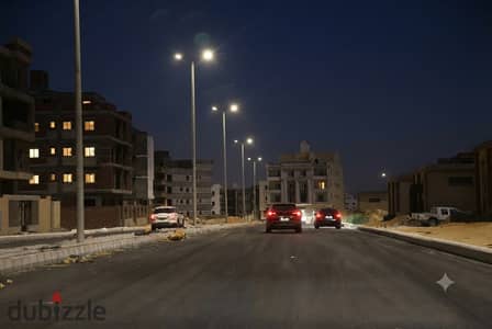 Corner unit facing a walkway and a 32-meter-wide street – North House – Beit Al-Watan – Fifth Settlement.