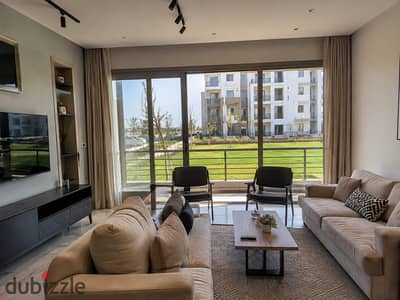 Ground-floor apartment with a private garden, fully finished and ready for viewing in New Zayed, next to Emaar.