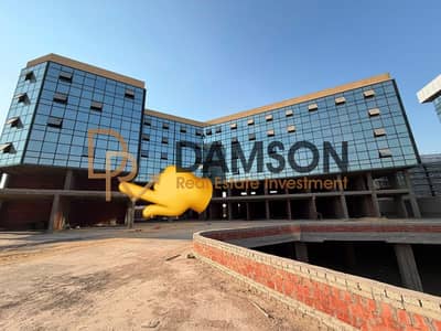 Prime 55m commercial shop for sale in the First District New Cairo with 1-year delivery ideally located near North 90th Street and major roads