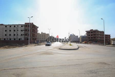 ارض للبيع بالنورث هاوس تاني نمرة من طريق السويس بيت الوطن التجمع الخامس القاهره الجديده