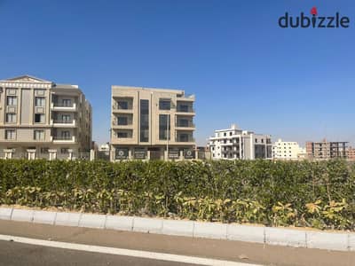 ارض للبيع علي مثلث حديقة تاني نمرة من شارع رئيسي في بيت الوطن التجمع الخامس القاهره الجديده
