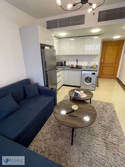 A distinctive, fully furnished 50-square-meter studio is available for rent in the Porto New Cairo compound, located in the Fifth Settlement