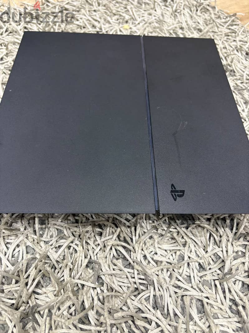 PS 4 with 2 controllers excellent condition 2