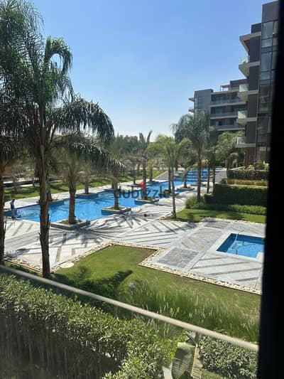 Apartment in a prime location for sale at El Patio Oro Compound, New Cairo  Second floor  Area: 128 sqm  2 bedrooms (including a master bedroom)  2 ba