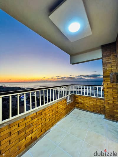 Apartment in Al-Ajami, Al-Nakheel Beach, full sea view, luxurious and distinctive finishing next to the main street and all services