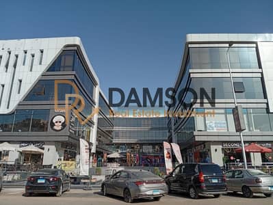 45 sqm commercial shop for sale, immediate delivery, already leased in Al Banafseg Villas, New Cairo, near 90th Street and major roads.