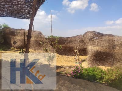 Farm for sale in a compound, 2400m². Builds 120m² (2 floors). Cash/installments. Cultivated with annual yield. Perfect for investment/relax.