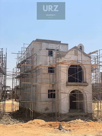 Corner villa with 5 bedrooms and 3 floors featuring a panoramic view for sale on Suez Road near AUC Mountain View Jayd Taj City  Madinaty