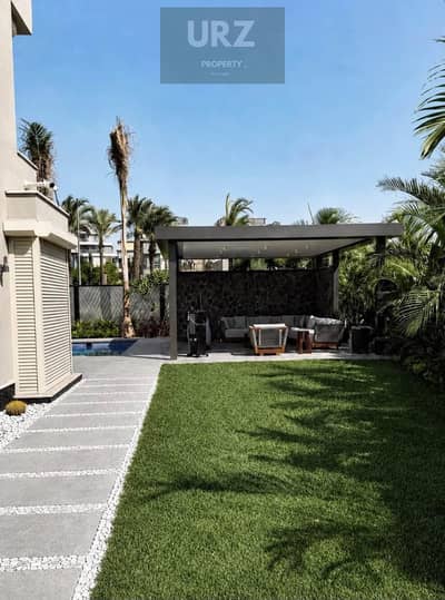 Corner villa with 5 bedrooms 3 floors and direct lake view 12 year installments in Sarai near Madinaty Butterfly and Mountain View