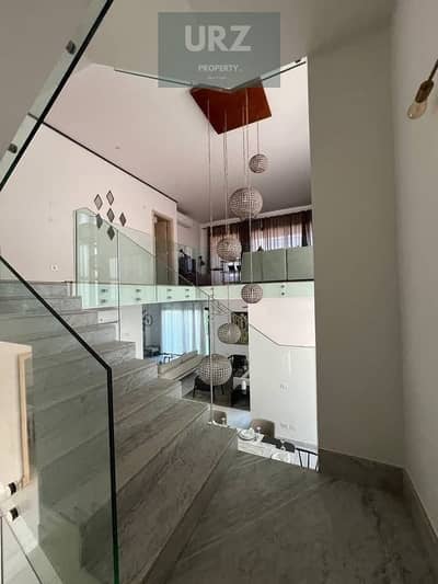 Standalone villa with 5 bedrooms private pool fully finished panoramic view 15 year installments directly on Suez Road near SODIC East El Burooj and L