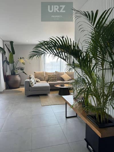 2 Bedroom apartment with a stunning double view 12-year installments or huge discount, on Suez Road minutes from AUC near Madinaty The Spine Tower