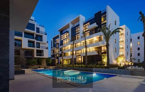 4-bedroom apartment fully finished with an open view of the lagoon at Waterway West next to Cairo Gate Emaar