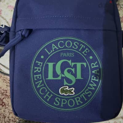 شنطه لاكوست اصليه  وارد الخارج lacost جديده لم تستخدم بالتكيت