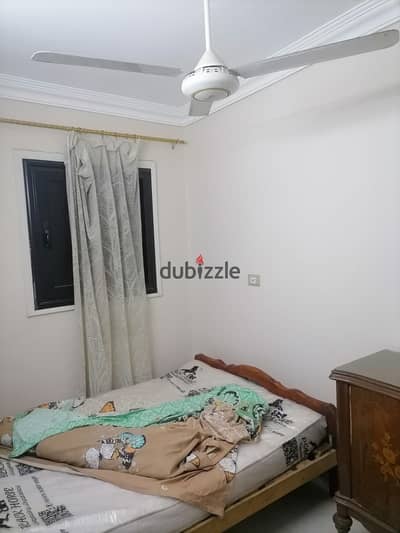 Furnished apartment for rent in the heart of Maadi, peaceful street close to Union Square, the metro, and all services and transport. First floor, consisting of two bedrooms, a living room, a bathroom, and a kitchen with natural gas. There is air conditioning in the main room. For inquiries and viewing.