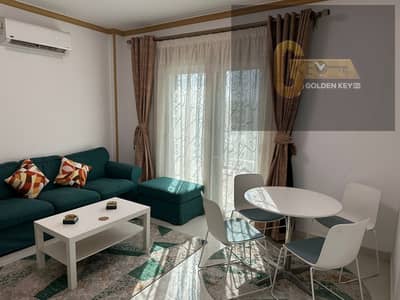 A fully furnished studio for rent in Al Rehab with a private garden and upscale furnishings.
