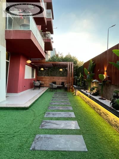 Furnished ground-floor apartment with a garden for rent in the Smart Life Compound, New Cairo (near the American University). First-time occupancy