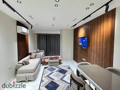 Furnished apartment for rent in One Kattameya Compound (Memaar Al Morshedy); first-time occupancy, hotel-style finishing.