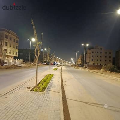 Land for sale facing a 32-meter wide separation strip, just steps away from services, in the Beit Al-Watan district, Fifth Settlement, New Cairo.