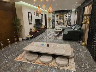 Fully furnished triplex for sale in Sodic Eastown with private roof ready to move premium finishing prime location New Cairo