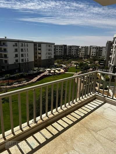 A two-bedroom flat on the second floor at the lowest price in Taj City | Stunning views and a prime location next to Cairo Airport, on the Ring Road