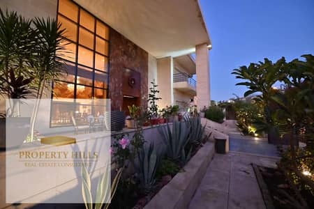 A stunning 730 sq m villa for sale, ready for immediate occupancy upon signing the contract, in a prestigious compound directly opposite Al Rehab gates and adjacent to Katameya Dunes.