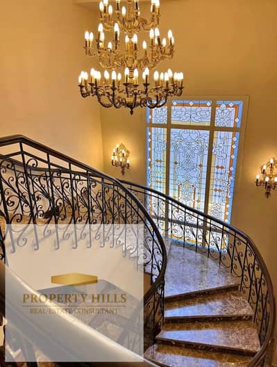 A stunning 590 sq m villa is for sale, ready for immediate occupancy upon signing the contract, in a prestigious compound directly opposite Al Rehab gates and adjacent to Katameya Dunes.