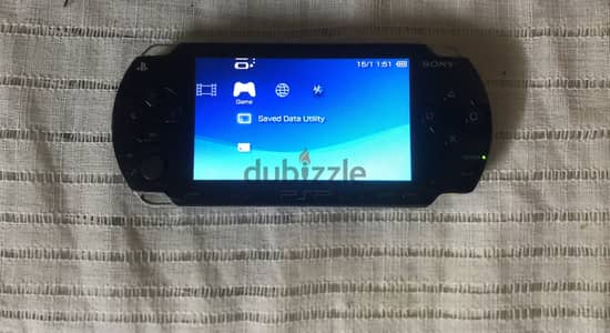 PSP-1003 عليه حوالي 50 لعبه-بحالة كسر زيرو