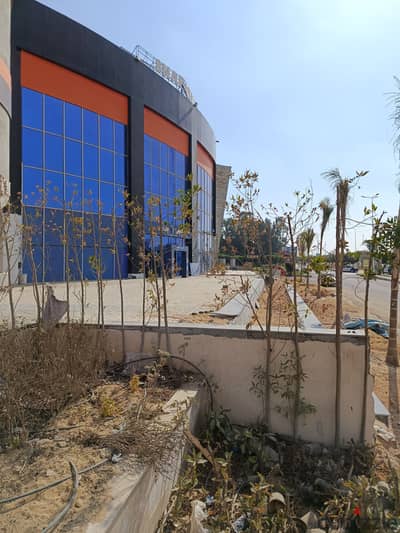 Commercial store fronting a main street 115m + external area in Al-Shorouk City, Villas Area
