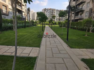 What does a 131 square meter apartment on the first floor with an open view and fully paid at 6.3 in Madinaty mean?