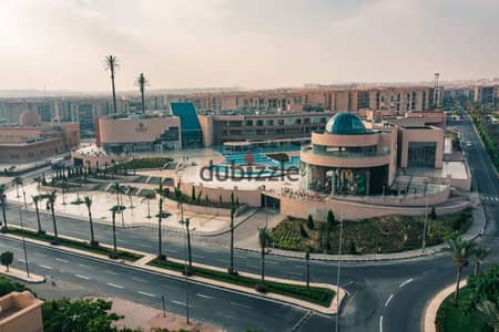 For rent in Al Rehab, a 131 sqm apartment with a very special view overlooking Omar bin Al-Khattab Mosque and Avenues Mall