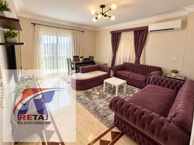 Furnished apartment for rent in New Cairo (Fifth Settlement, First District), directly facing Akhenaten School and situated on a main street.